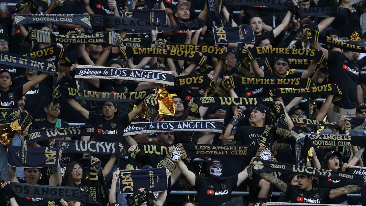 Los Angeles Football Club fans rally with their towels before a game with the Galaxy at the Banc of California Stadium on July 26.
