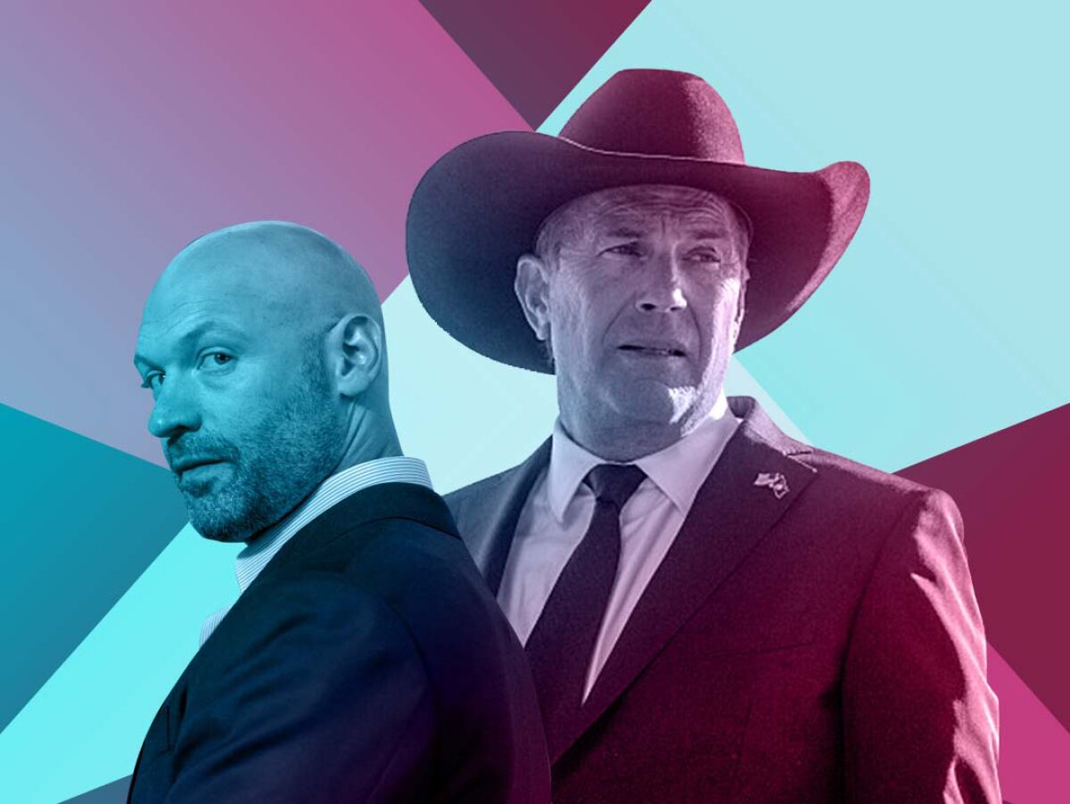 A bald man in a suit and a man in a suit with a cowboy hat. Spotlights cross behind them.