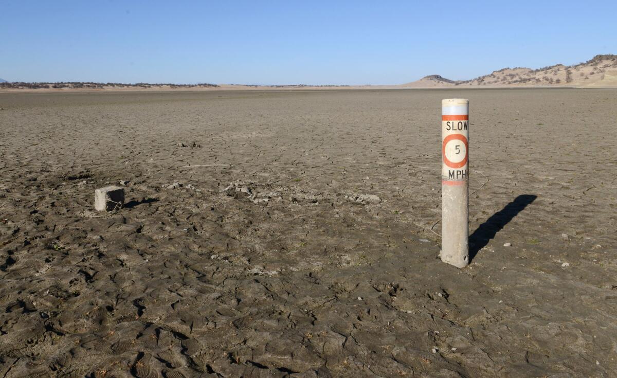 A 5 mph boating speed limit buoy is stuck in the ground as there is no water to be seen at Black Butte Lake near Orland Buttes Recreation Area.