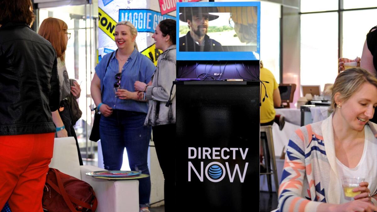 DirecTV Now gained 49,000 subscribers last quarter. Above, DirecTV Now signage at a festival in New York in May.