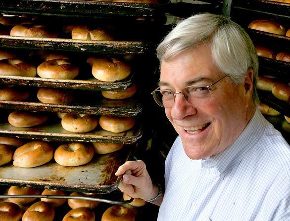 Richard Friedman admires the handiwork at his L.A. bakery, Brooklyn Bagel. The story of bagels in L.A. is the story of two bakeries  the one started by Friedmans father, Seymour, in 1953 and 61-year-old Western Bagel. There are plenty of Jewish delis in Southern California, and most of the best-known buy their bagels from one of the two competitors.