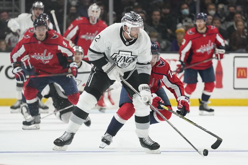 Los Angeles Kings defenseman Alexander Edler (2) takes a shot against Washington Capitals left wing Conor Sheary (73) during the third period of an NHL hockey game Wednesday, Nov. 17, 2021, in Los Angeles. (AP Photo/Ashley Landis)