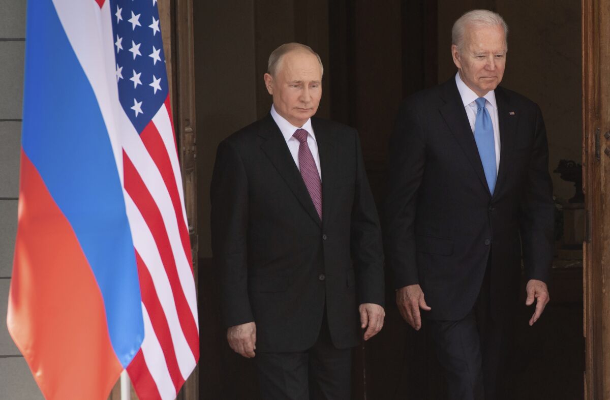 Russian President Vladimir Putin and President Biden stand side by side. 