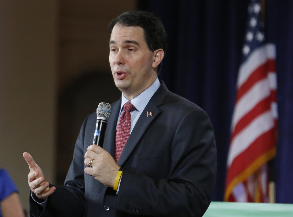 Wisconsin Gov. Scott Walker, speaking in Florida in February, is losing popularity at home. Walker's job approval fell to 41% with 56% disapproving, a new Marquette Law School poll shows.
