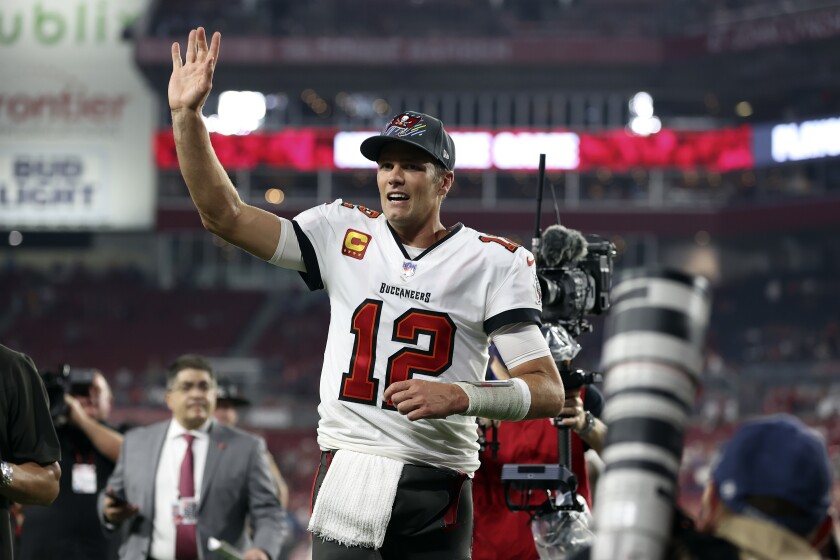 Tampa Bay Buccaneers quarterback Tom Brady (12) waves to fans after the team defeated the Carolina Panthers during an NFL football game Sunday, Jan. 9, 2022, in Tampa, Fla. (AP Photo/Mark LoMoglio)
