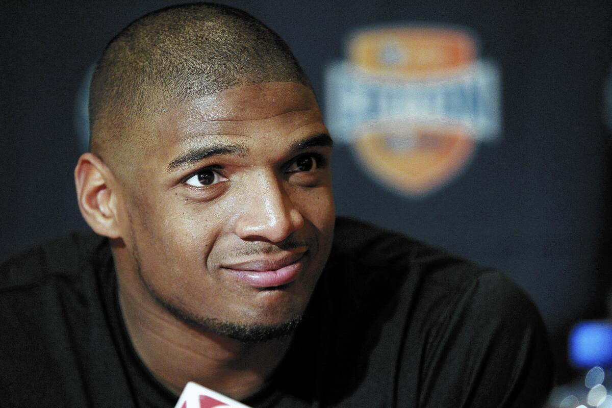 Missouri senior defensive lineman Michael Sam is seen speaking to the media during an NCAA college football news conference in Irving, Texas. Sam says he is gay, and he could become the first openly homosexual player in the NFL.