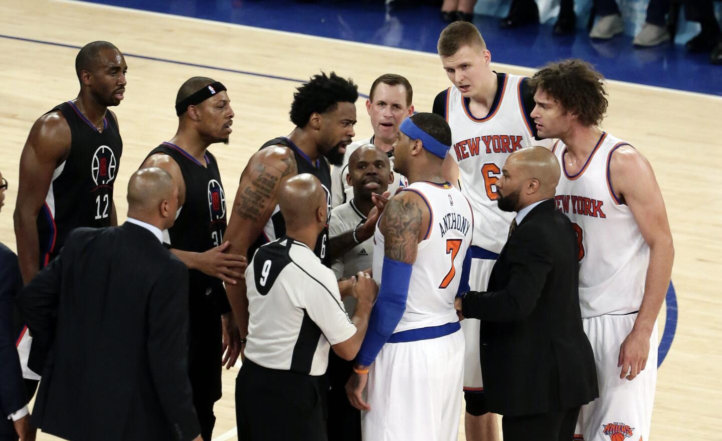 Clippers center DeAndre Jordan gets in the face of New York Knicks forward Carmelo Anthony (7) after a foul was called on Knicks center Robin Lopez, right, in the second half on Friday.