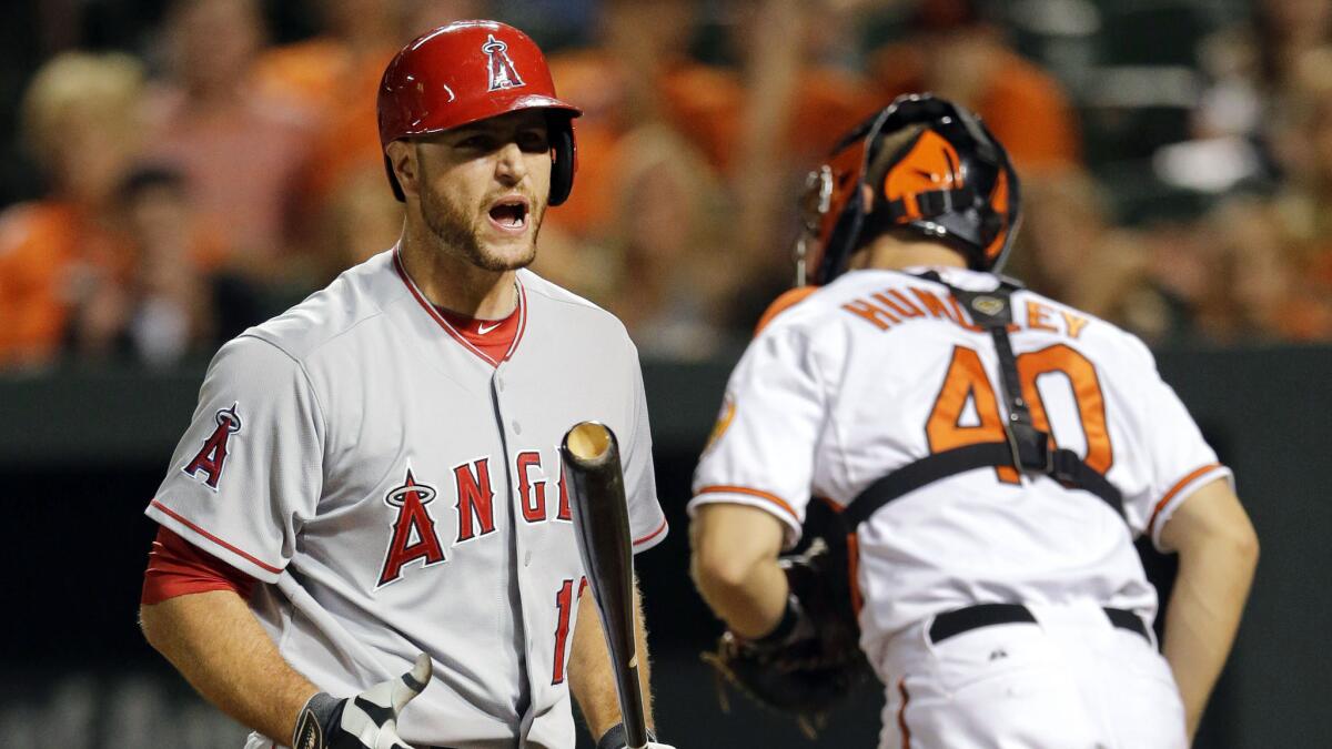 Angels catcher Chris Iannetta reacts after striking out to end the top of the 11th inning in the team's 7-6 loss in 12 innings to the Baltimore Orioles on Tuesday.