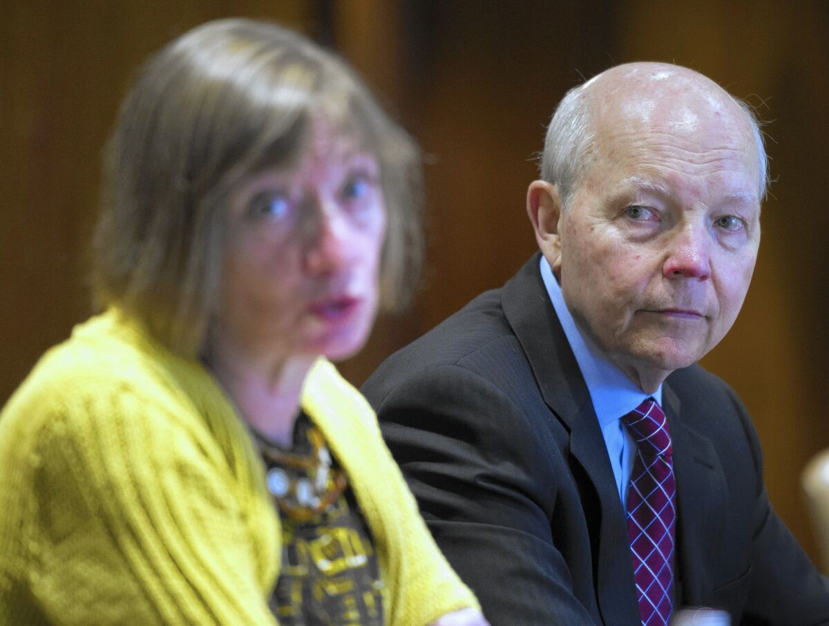 IRS Commissioner John Koskinen says that crippling the agency’s resources represents “a tax cut for tax cheats.” He appeared above with Nina Olson, the national taxpayer advocate, at a news conference in June.