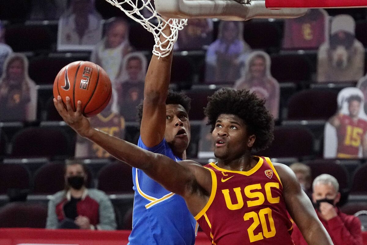 USC's Ethan Anderson shoots as UCLA's Jaylen Clark defends during the second half Feb. 6, 2021.