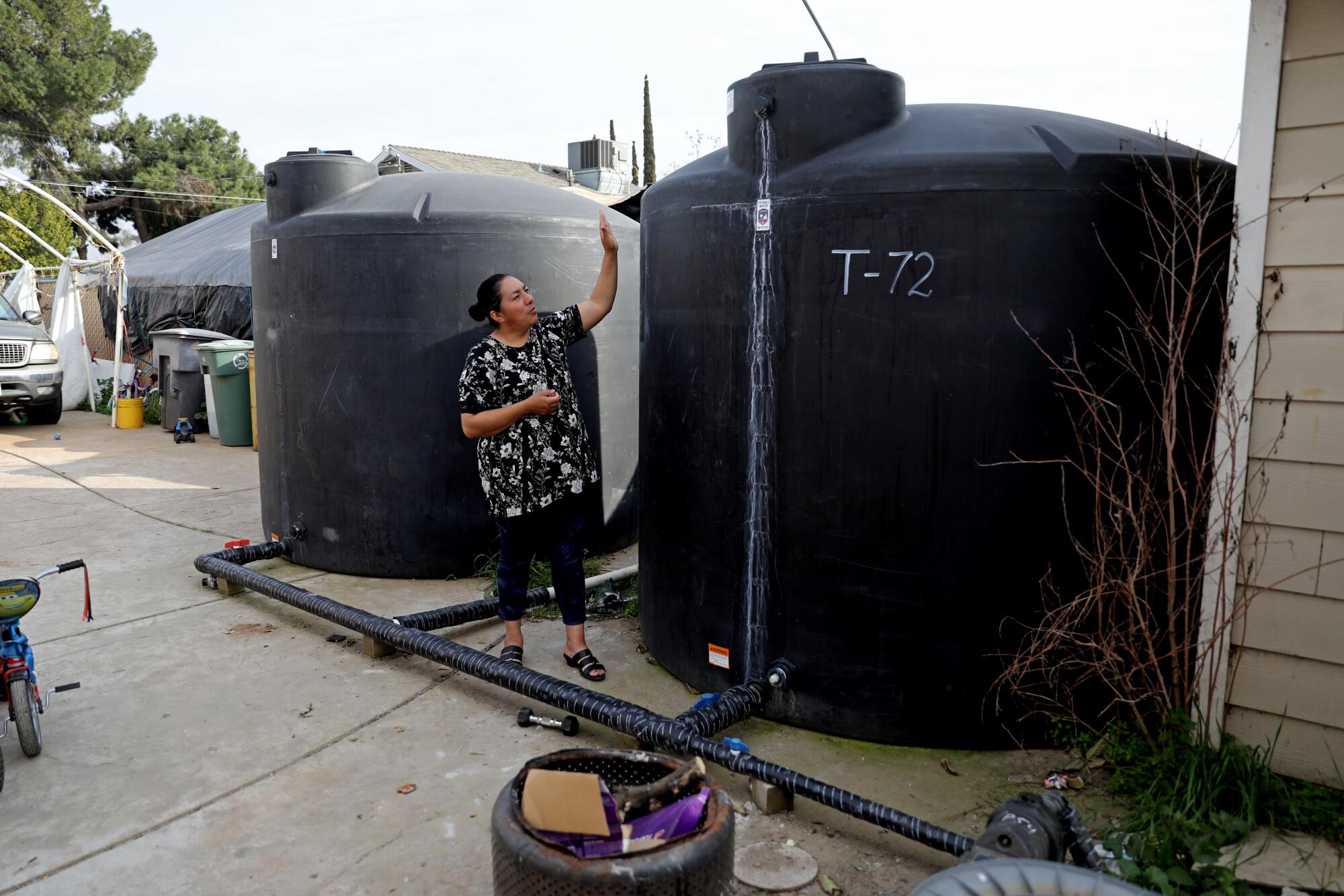 Carolina Ledesma García relies on water delivered to a 2,500-gallon tank at her home in Fresno County.