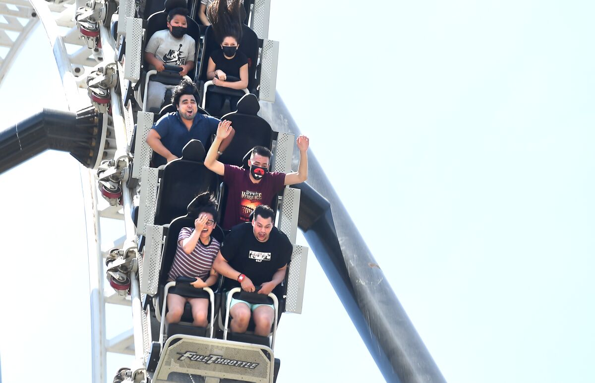 People enjoy the the Full Throttle ride at Six Flags Magic Mountain in Valencia during California reopening day.