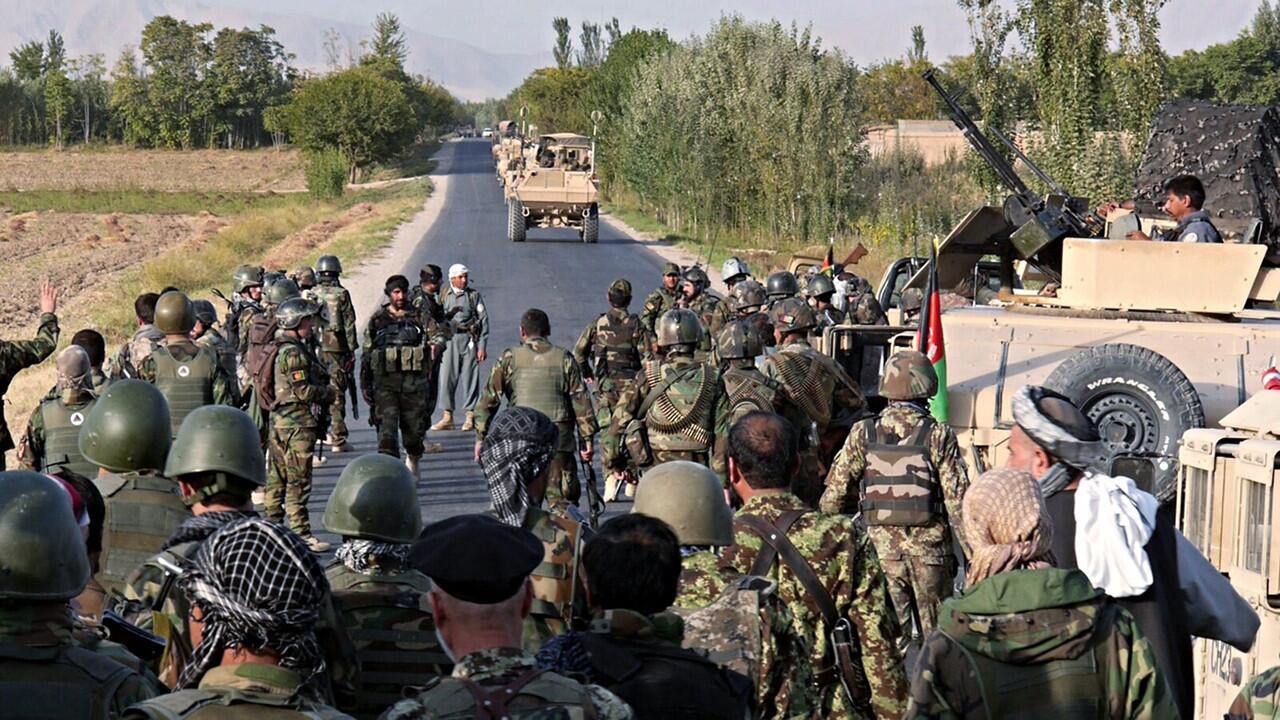 Members of the Afghan security services and national army secure a road leading to the Baghlan-Kunduz provincial border on Wednesday.