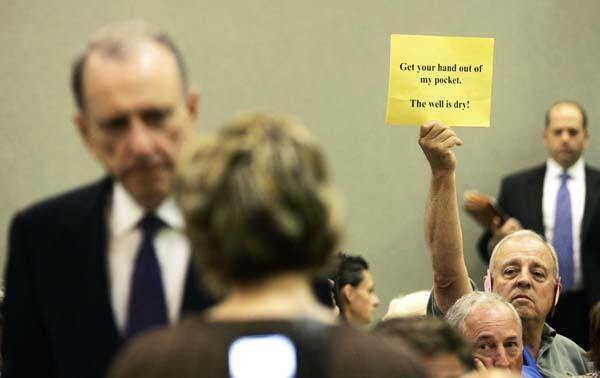 A man protests at a town hall meeting in Pennsylvania