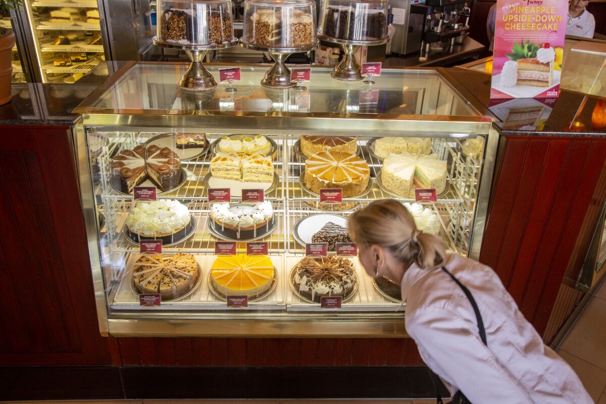 A customer checks out the dessert display at the Cheesecake Factory in Marina del Rey.