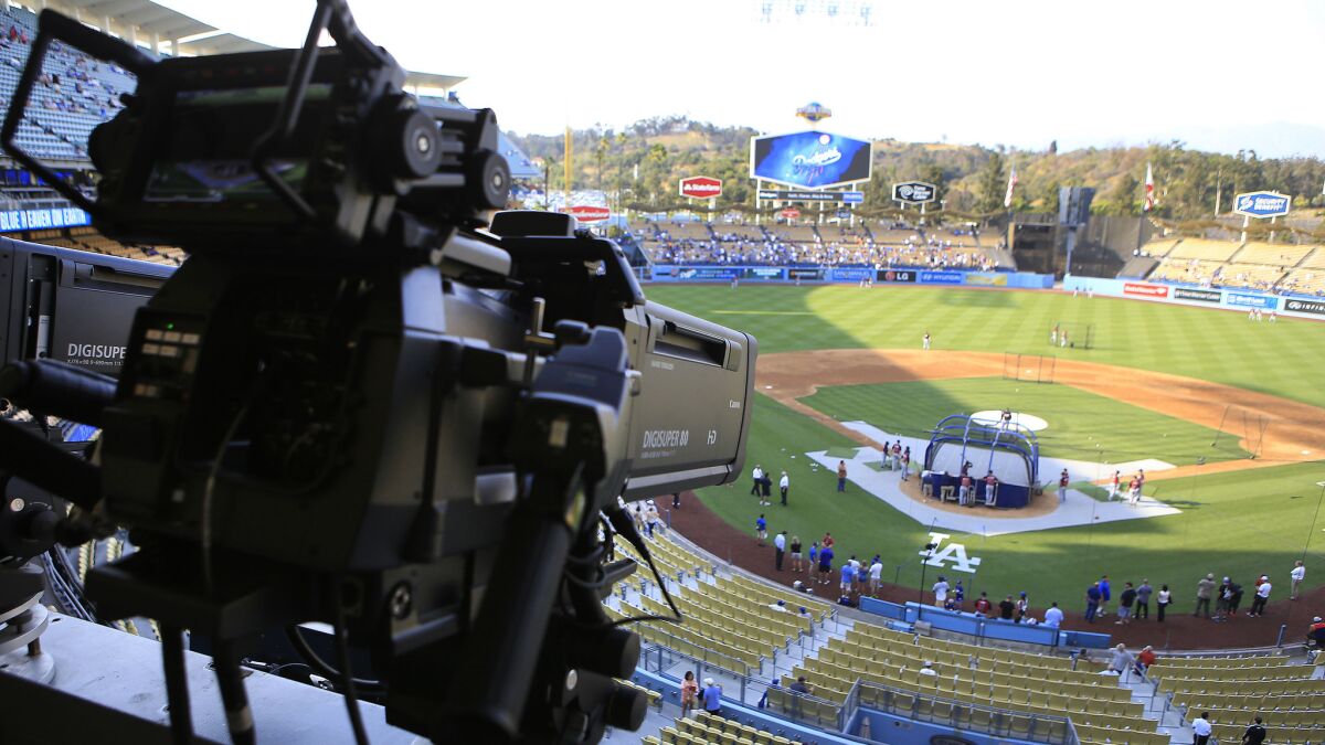 A television camera is pointed toward home plate at Dodger Stadium before a game in July 2014.