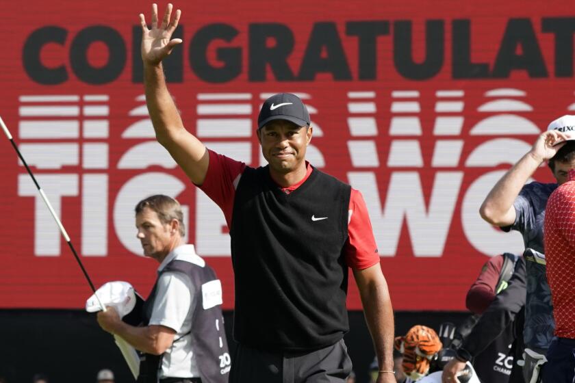 FILE - In this Oct. 28, 2019, file photo, Tiger Woods celebrates after winning the Zozo Championship.