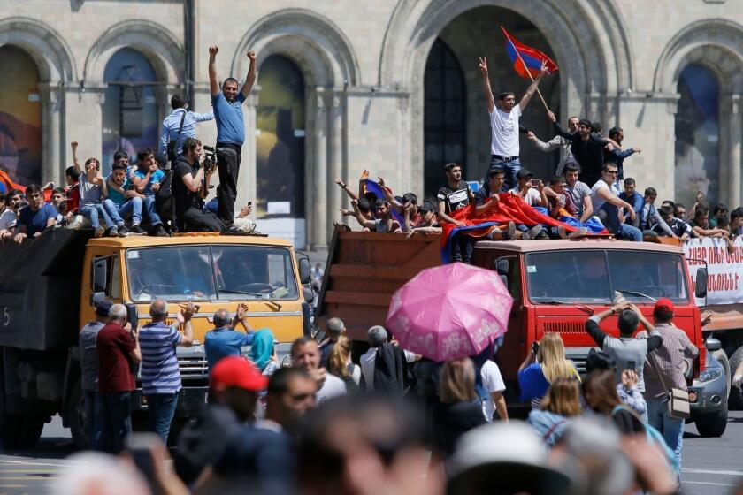 Mandatory Credit: Photo by ZURAB KURTSIKIDZE/EPA-EFE/REX/Shutterstock (9656304ae) Armenian protestors ride on trucks as they block a street in Yerevan, Armenia, 02 May 2018. Opposition supporters demand that the acting prime minister, a representative of the ruling Republican Party of Armenia, be replaced by a people's candidate before early parliamentary elections take place. Opposition rally in Armenia, Yerevan - 02 May 2018 ** Usable by LA, CT and MoD ONLY **