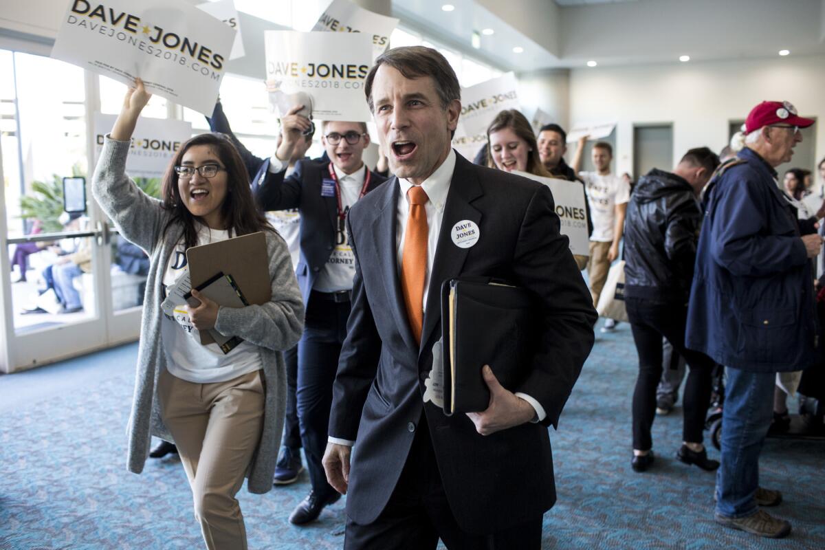 California Insurance Commissioner Dave Jones and supporters walk in the hallway during the California Democratic Convention in San Diego.