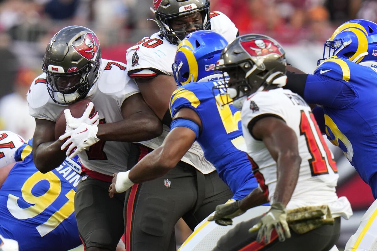 Tampa Bay Buccaneers running back Leonard Fournette carries the ball against the Rams in the first quarter.