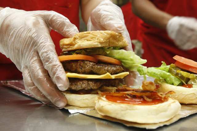 For a while, this Lorton, Va.-based chain was expanding so fast, it was opening five stores a week. Since launching in 1986, Five Guys has grown to more than 1,000 locations, largely on the strength of word of mouth. The company doesn't freeze any of its food, doesn't operate drive-thrus and is free of ostentation (all of its stores have the same red-and-white checkered interior). The food is bought at a counter, cooked in an open kitchen and picked up by the diner. The menu is simple: burgers, hot dogs, a few sandwiches and hand-cut fries. But with an option for unlimited toppings, which include jalapeno peppers, grilled mushrooms and hot sauce, customers can order burgers 250,000 ways. A standard hamburger costs $5.49 in Los Angeles; overall sales for the chain spiked 32.8% last year to $951 million, according to Technomic. The chain says its menu is free of trans fats. In 2010, however, the Xtreme Eating list from the Center for Science in the Public Interest said Five Guys' bacon cheeseburger, with at 920 calories, is equivalent to about two McDonald's Quarter-Pounders.