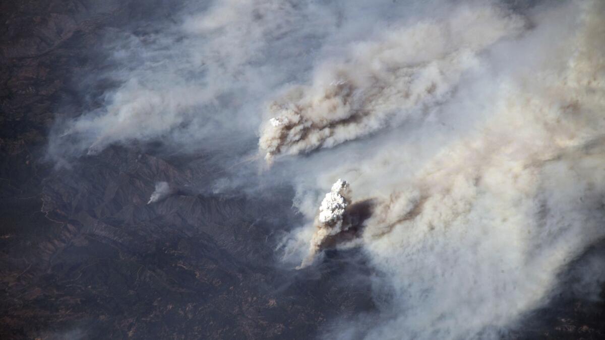 This Aug. 3, photo by European Space Agency astronaut Alexander Gerst aboard the International Space Station, provided by NASA, shows smoke from California's Carr and Ferguson fires blowing eastward across the western United States.