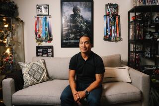 Woodland Hills, CA - November 15: Ryan Lastimosa, a game industry veteran, whose entire team was laid off or reorganized, and he choose to leave his previous company and poses for a portrait at his home office on Wednesday, Nov. 15, 2023 in Woodland Hills, CA. The video game industry has been hit with more than 6,500 layoffs over the last year. (Dania Maxwell / Los Angeles Times)