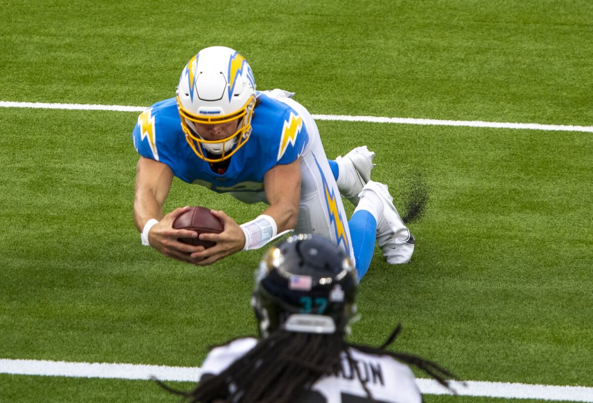 Jacksonville Jaguars cornerback Tre Herndon can't stop Chargers quarterback Justin Herbert.