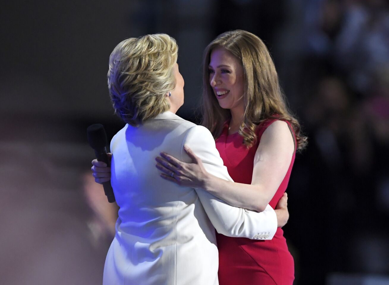 Chelsea Clinton, embraces her mother, Democratic presidential nominee Hillary Clinton, during the final day of the Democratic National Convention.