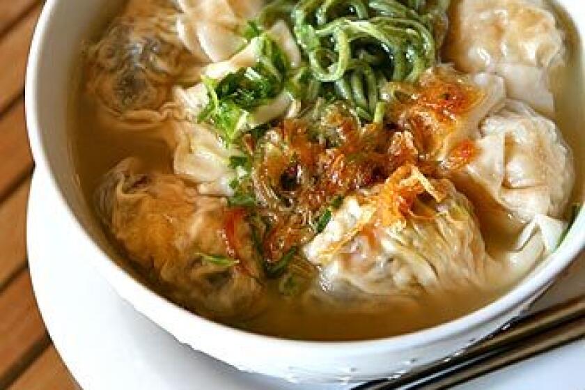 The combo molokhia noodle soup is wontons and dumplings with molokhia "green" noodles.