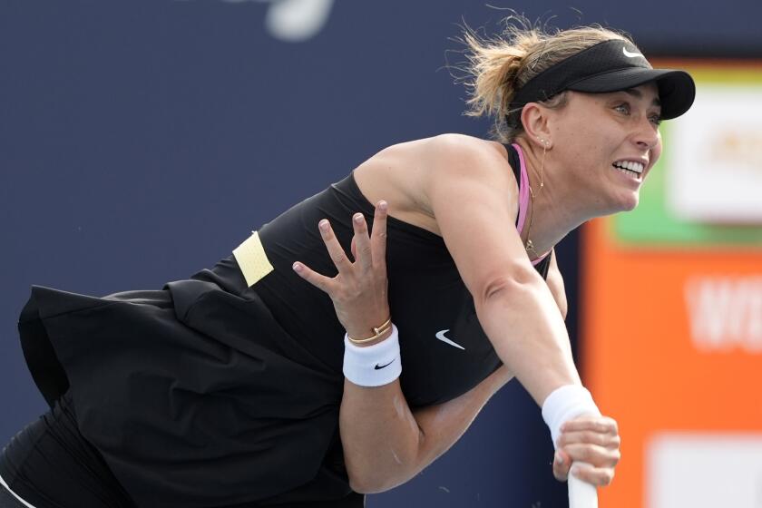 FILE - Paula Badosa of Spain, follows through on a serve to Aryna Sabalenka, of Belarus, during the Miami Open tennis tournament, Friday, March 22, 2024, in Miami Gardens, Fla. Paula Badosa says she and Stefanos Tsitsipas are no longer a love match. The tennis power couple has broken up. Badosa wrote on social media Sunday, May 5, 2024, that the pair “decided to amicably part ways” after being a couple since last year. (AP Photo/Lynne Sladky, File)