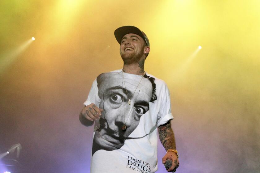 FILE - In this July 13, 2013, file photo, rapper Mac Miller performs on his Space Migration Tour in Philadelphia. A third man has been arrested and charged with drug offenses in connection with the overdose death of the rapper. Court documents show Steven Walter is suspected of selling counterfeit oxycodone pills laced with fentanyl that Miller possessed before he died of an accidental overdose last year of cocaine, alcohol and the powerful opioid. (Photo by Owen Sweeney/Invision/AP, File)
