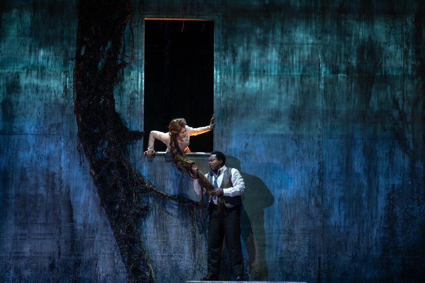 Los Angeles, CA - March 22: Sydney Mancasola, left, and Will Liverman, right, perform in the L.A. Opera dress rehearsal for a new production of Debussy's "Pelleas et Melisande" at the Dorothy Chandler Pavilion on Wednesday, March 22, 2023, in Los Angeles, CA. (Francine Orr / Los Angeles Times)