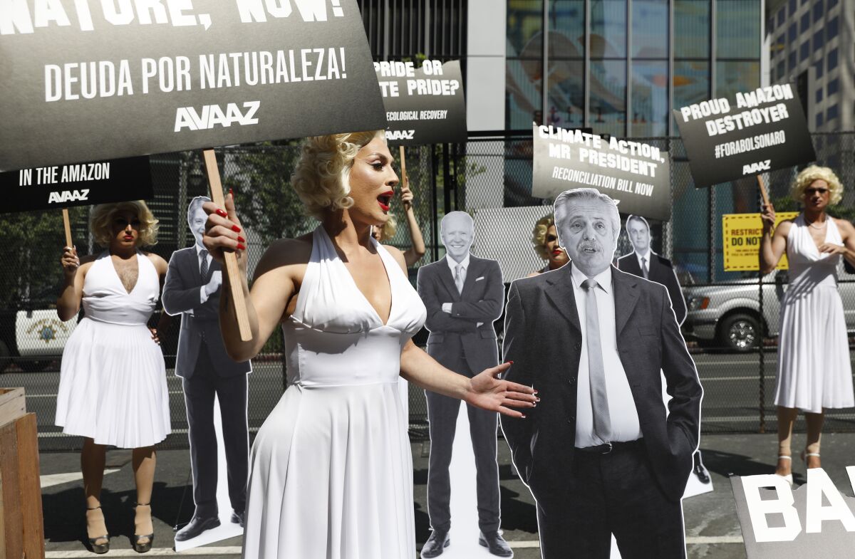 Drag queens dressed as Marilyn Monroe protest at the Summit of the Americas in downtown Los Angeles.