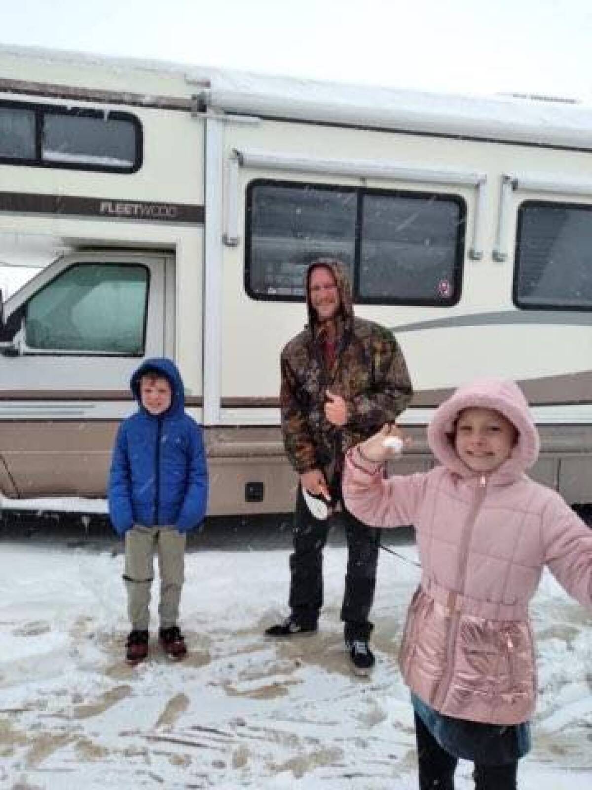 Jason Cassem, with his son Geoffrey and daughter Juliana pose in this undated photo. 