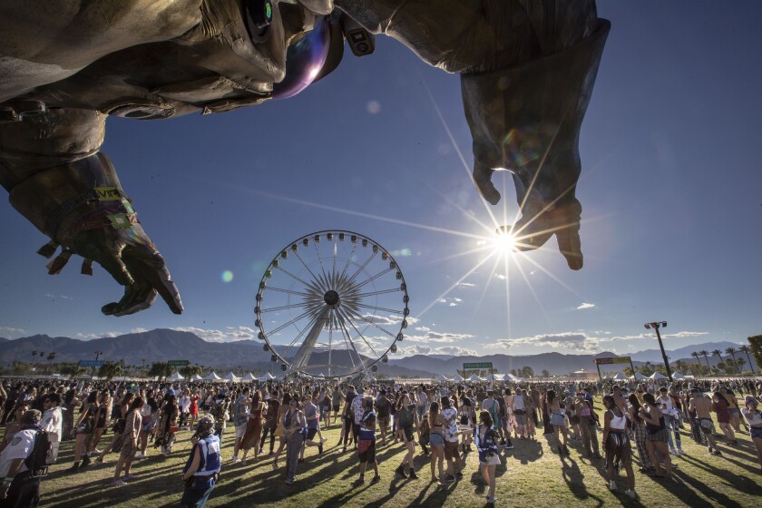 Hands of "The Astronaut" loom over the festival grounds during Day 1 at the Coachella Valley Music and Arts Festival on the Empire Polo Club grounds in Indio.