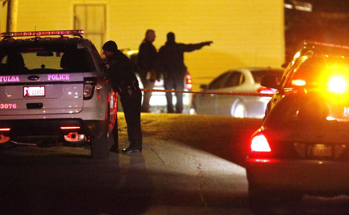 Police in Tulsa, Okla., investigate a shooting at a home Saturday night that left four people dead and one wounded.