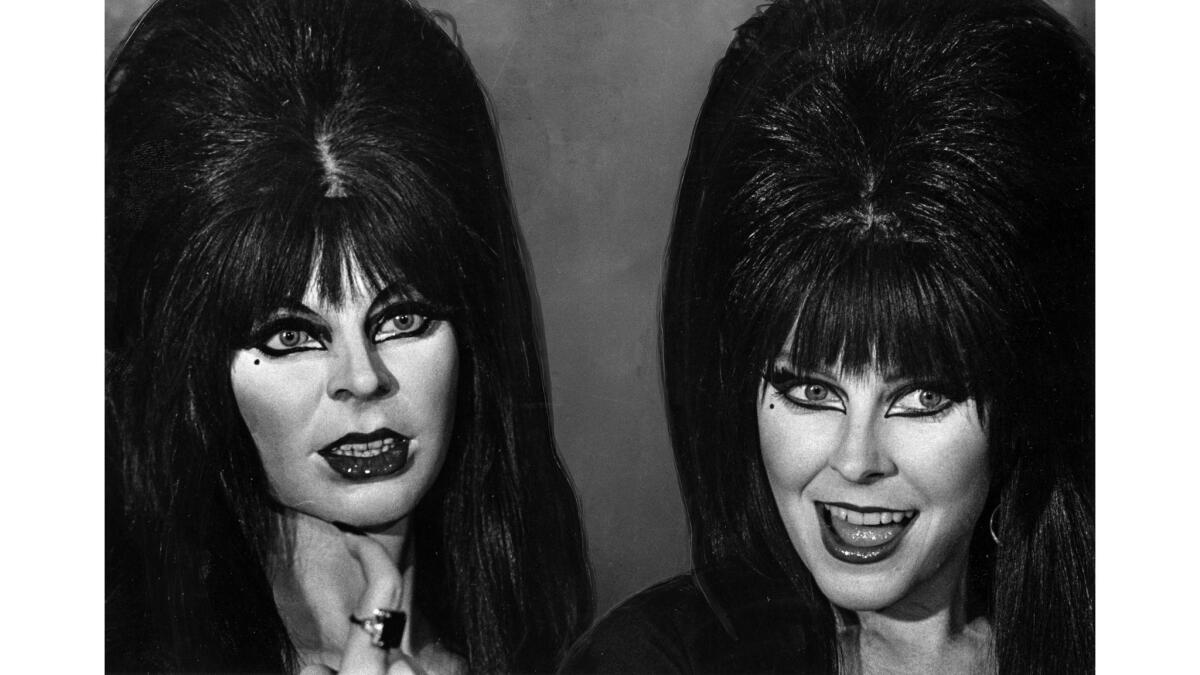 Oct. 21, 1985: Cassandra Peterson, right, as Elvira poses with her wax version twin at the Movieland Wax Museum in Buena Park. This photo was published in the Oct. 31, 1985, Los Angeles Times.