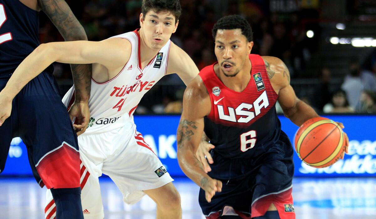 U.S. point guard Derrick Rose uses a screen by a teammate to drive past Turkey guard Cedi Osman during their game Sunday at the Basketball World Cup.