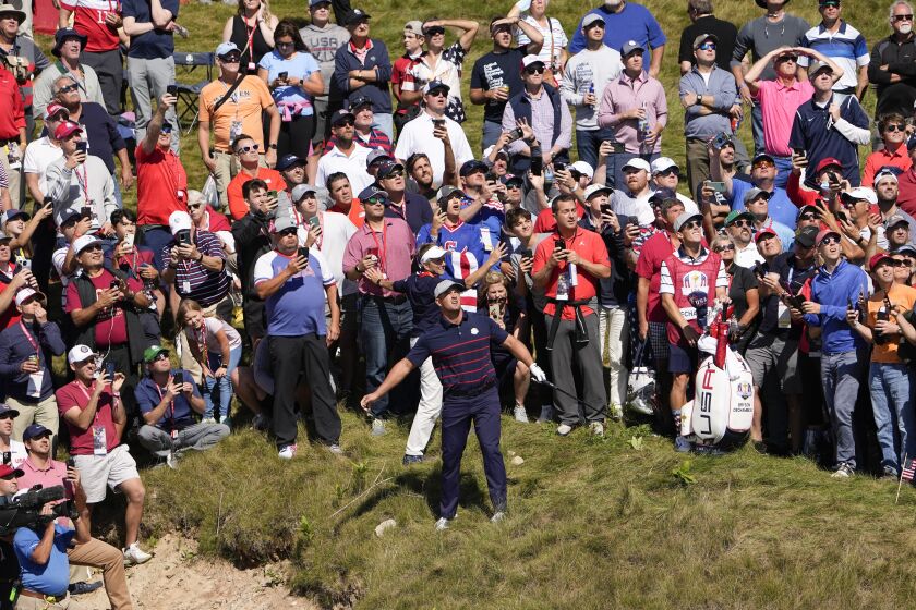 Team USA's Bryson DeChambeau watches his shot on the first hole during a four-ball match the Ryder Cup at the Whistling Straits Golf Course Friday, Sept. 24, 2021, in Sheboygan, Wis. (AP Photo/Jeff Roberson)
