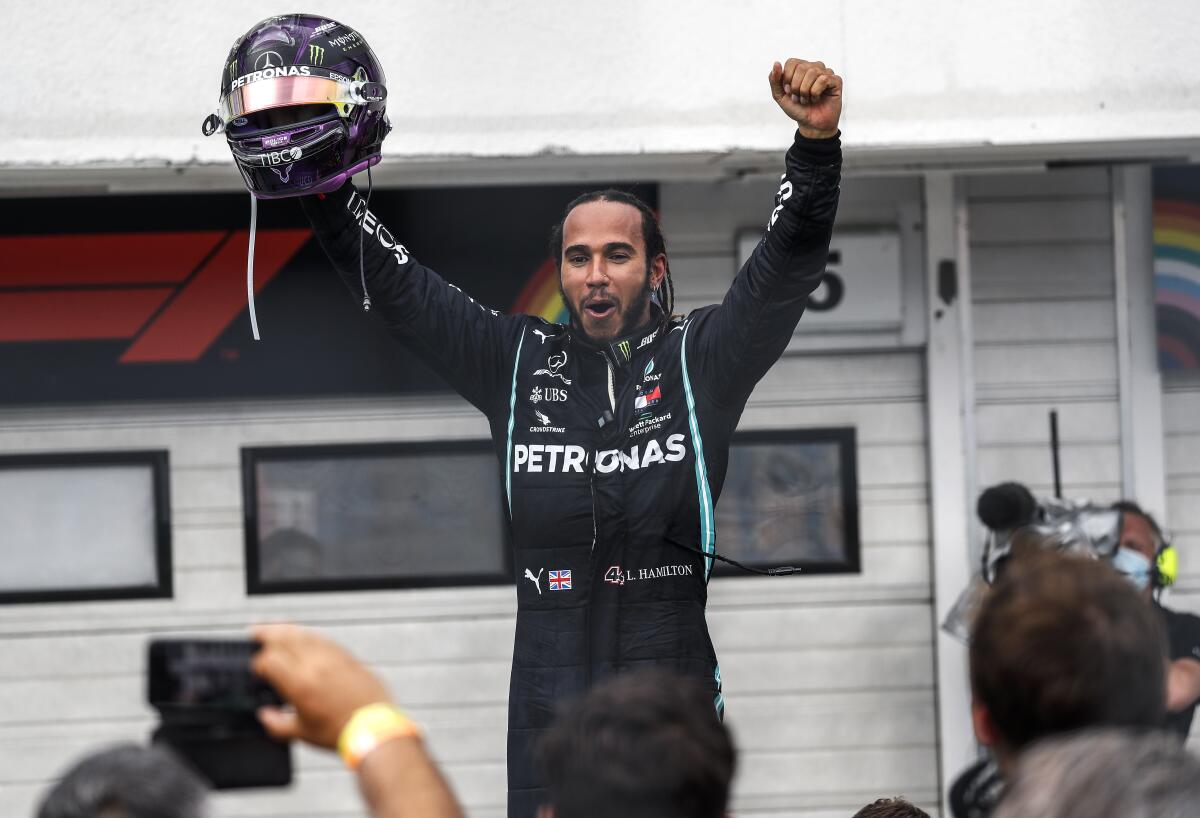 Mercedes driver Lewis Hamilton celebrates after winning the Hungarian Grand Prix.