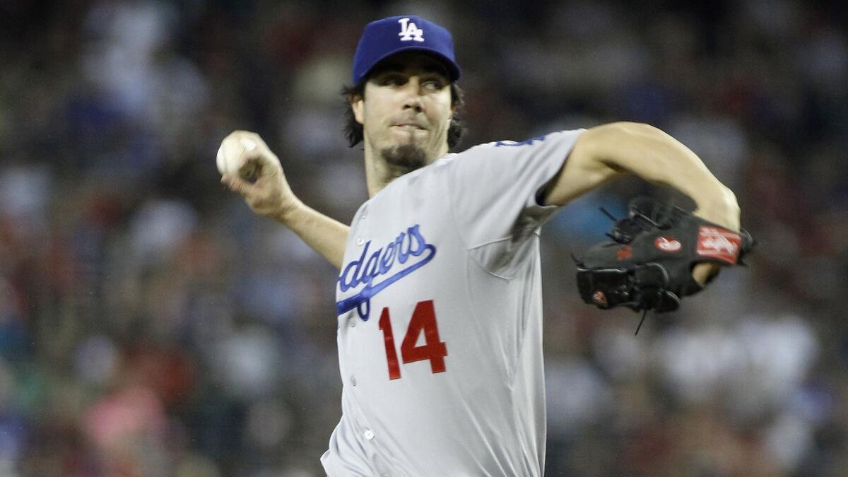 Dodgers starter Dan Haren delivers a pitch during the team's 5-3 loss to the Arizona Diamondbacks on Sunday.