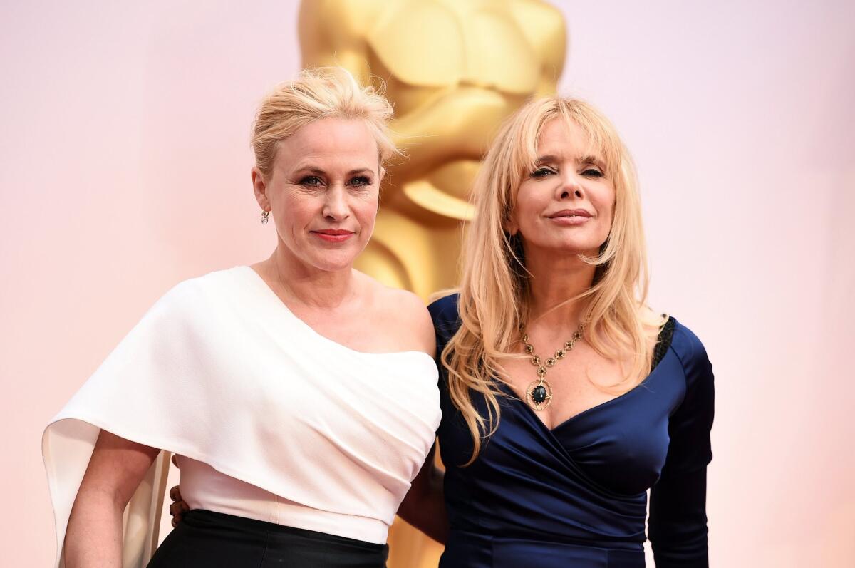 Patricia Arquette, left, and sister Rosanna arrive at the Oscars on Sunday.