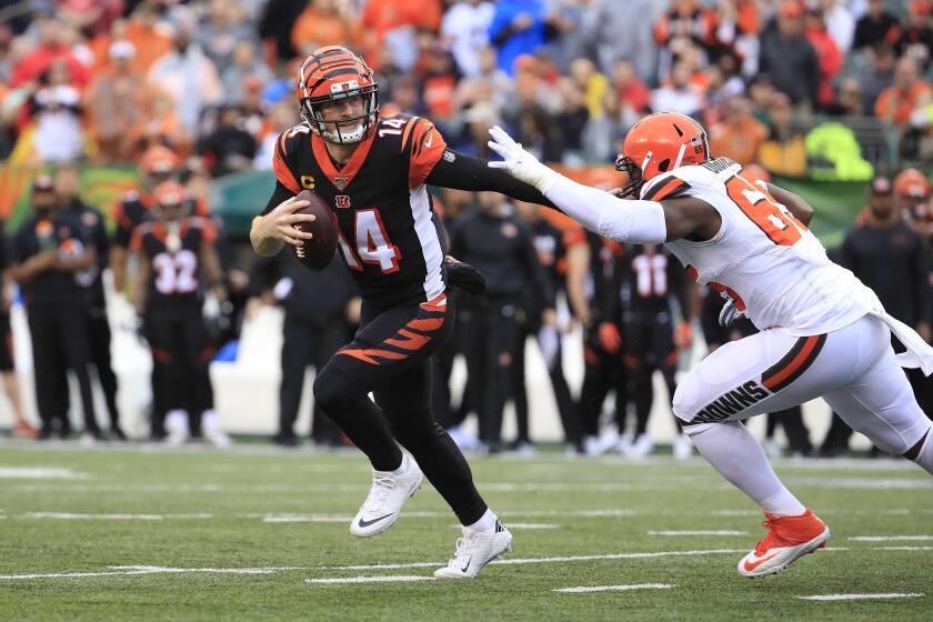 CINCINNATI, OHIO - DECEMBER 29: Andy Dalton #14 of the Cincinnati Bengals runs during the game against the Cleveland Browns at Paul Brown Stadium on December 29, 2019 in Cincinnati, Ohio. (Photo by Andy Lyons/Getty Images)