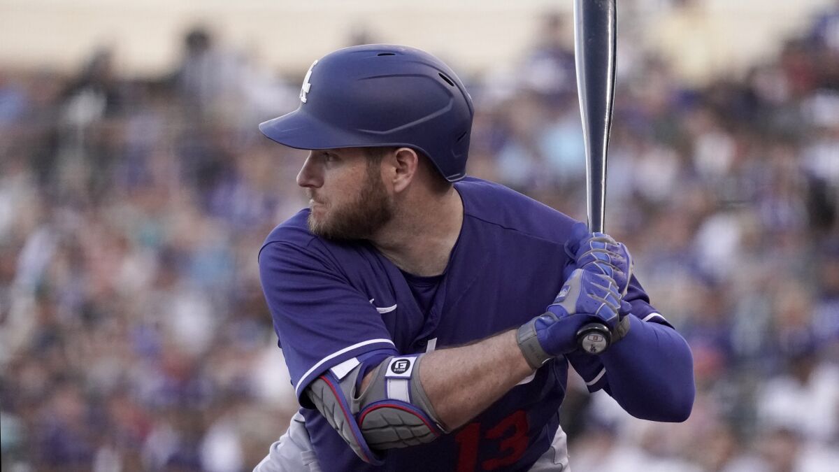 Los Angeles Dodgers' Max Muncy bats during the first inning of a spring training baseball game 