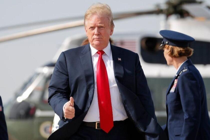 President Donald Trump gives a 'thumbs-up' as he prepares to board Air Force One, Thursday, April 18, 2019, at Andrews Air Force Base, Md. President Trump is traveling to his Mar-a-lago estate to spend the Easter weekend in Palm Beach, Fla. (AP Photo/Pablo Martinez Monsivais)