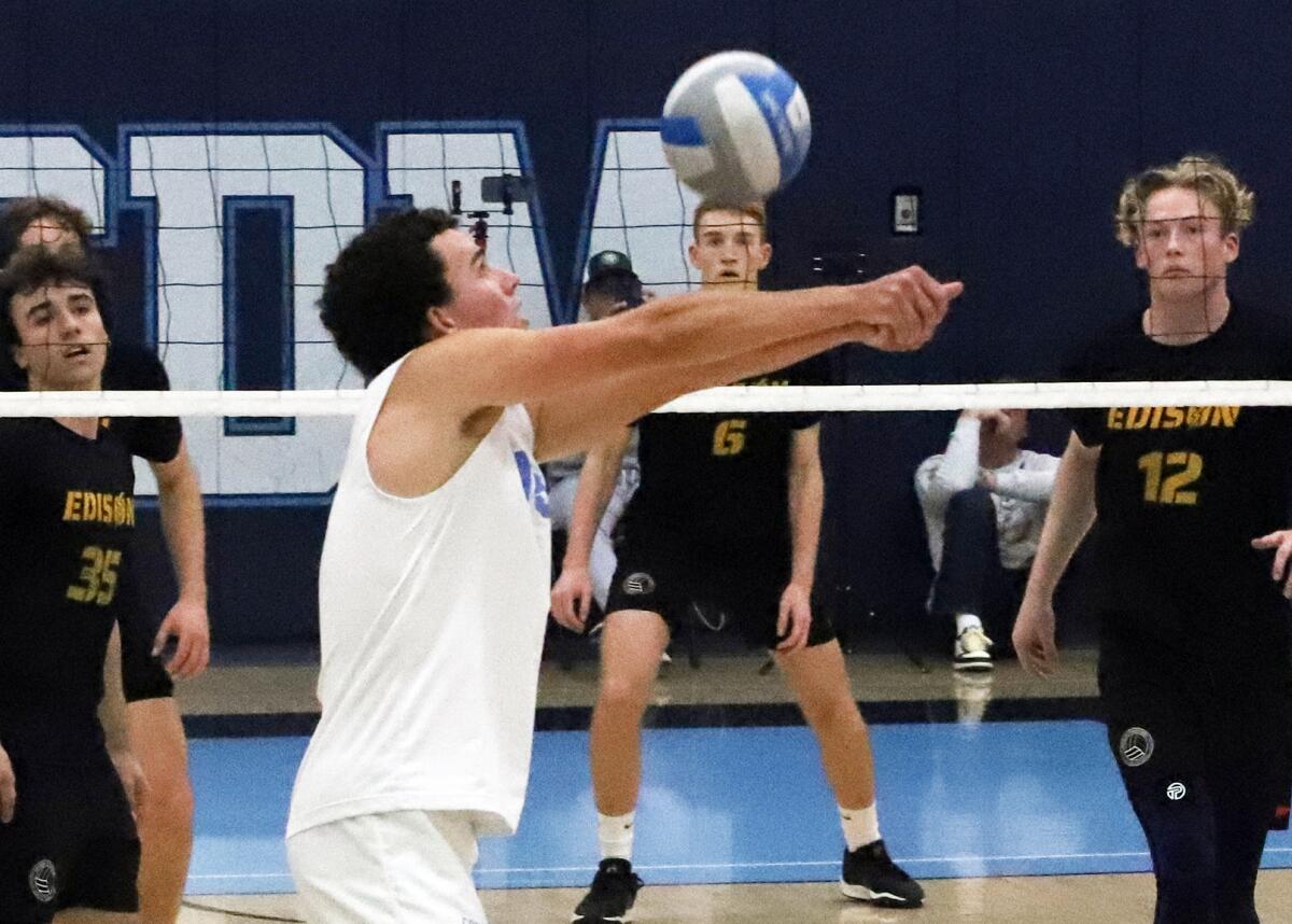 Corona del Mar's Everett Welton (13) passes the ball in a CIF Division 1 boys' volleyball playoff match on Wednesday.