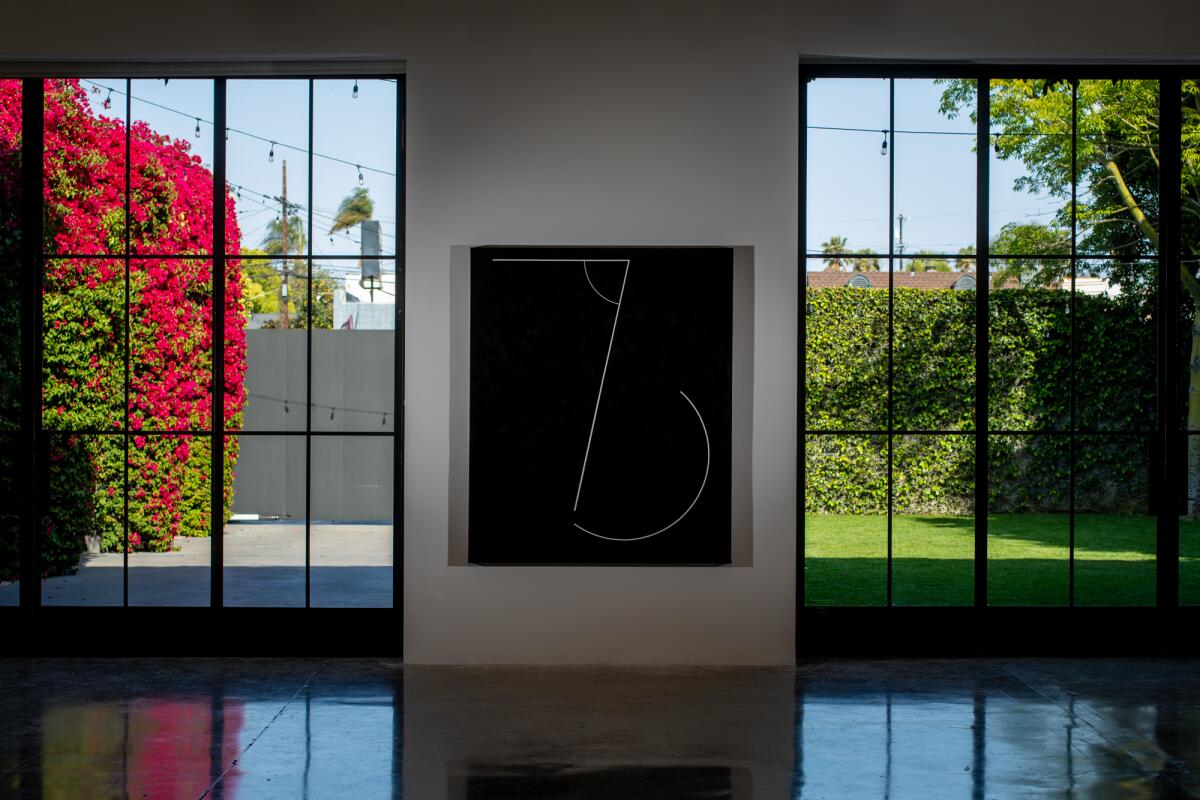 A piece of Jaramillo's work is mounted on the wall between two large windows at the Pace Gallery.