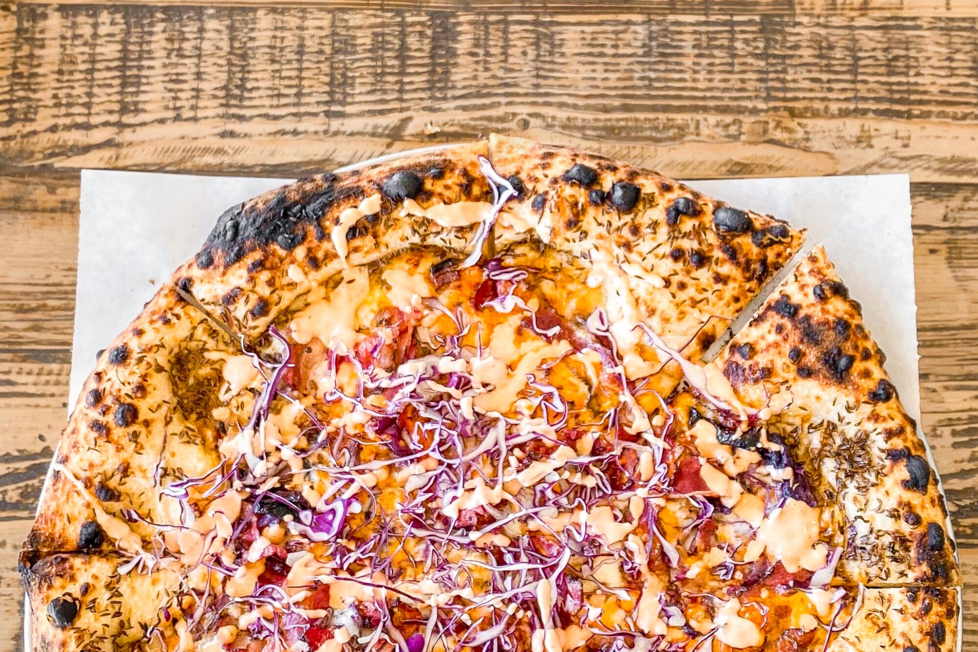 A whole pastrami-laced pizza pie