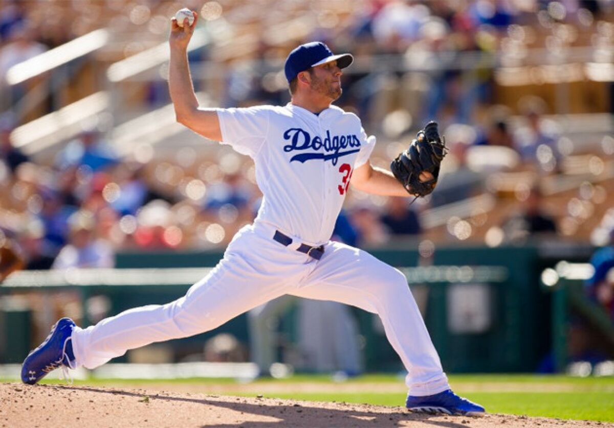 Dodgers pitcher Shawn Tolleson pitches during a spring training game against the Chicago Cubs.